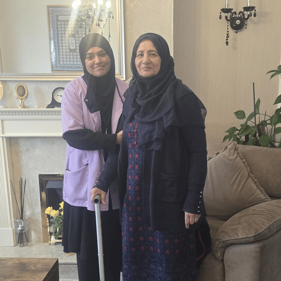 Thumhara assistant smiling with elderly asian lady